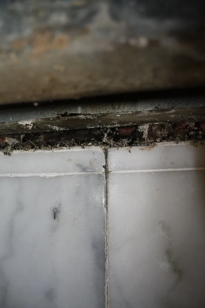 Close-up of a damaged wall base