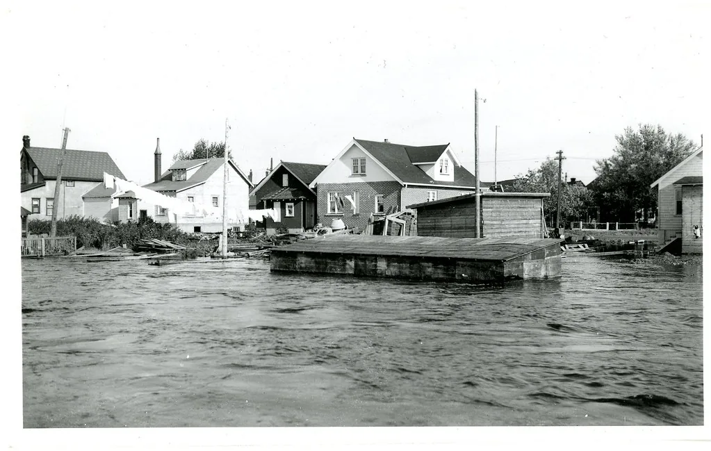 Residential street flooded with water around homes